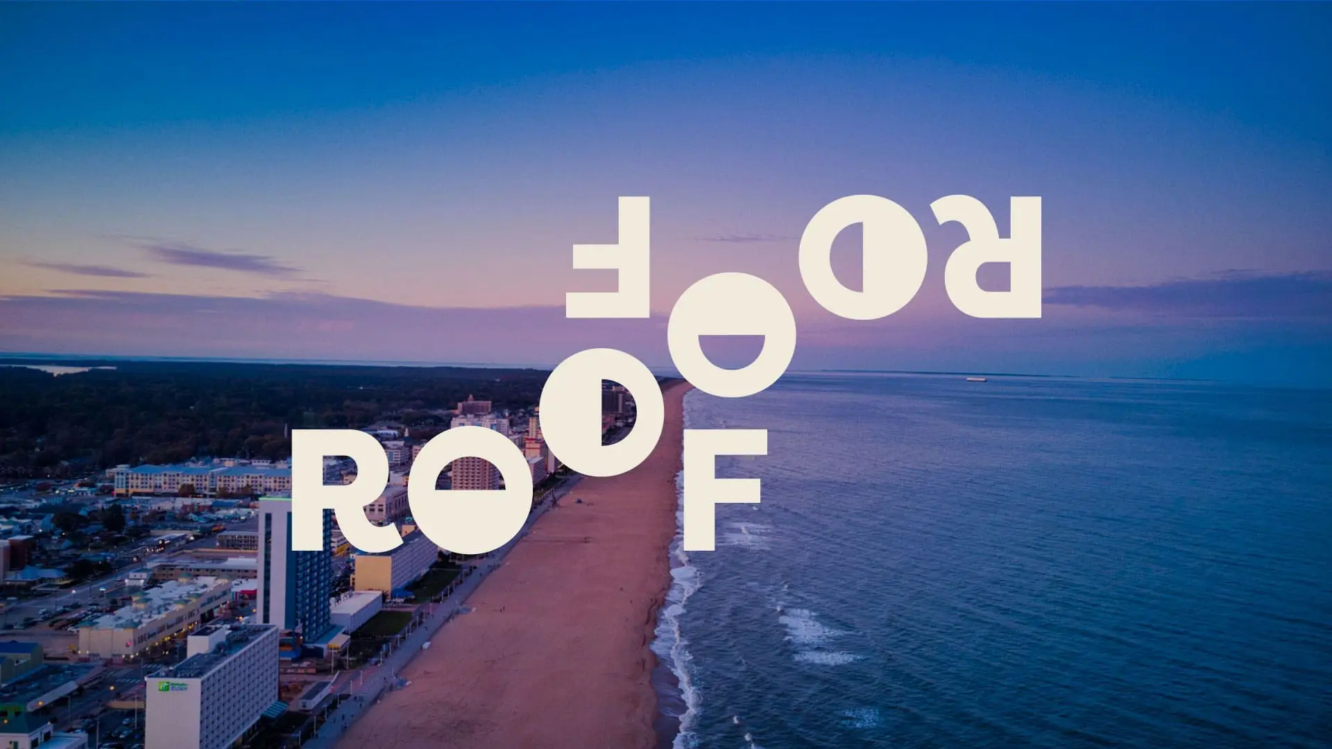 Roof Roof & Construction logo over Virginia Beach oceanfront shoreline.