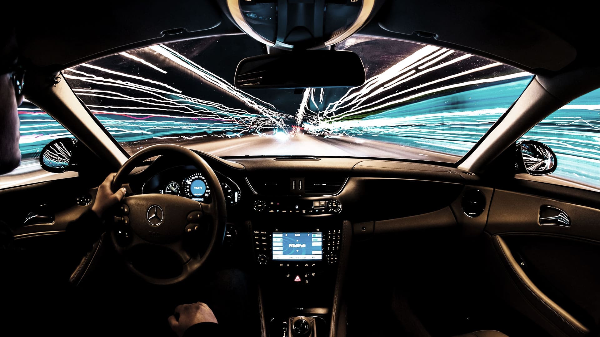 Dashboard pov of vehicle at night. Cover image for auani.com